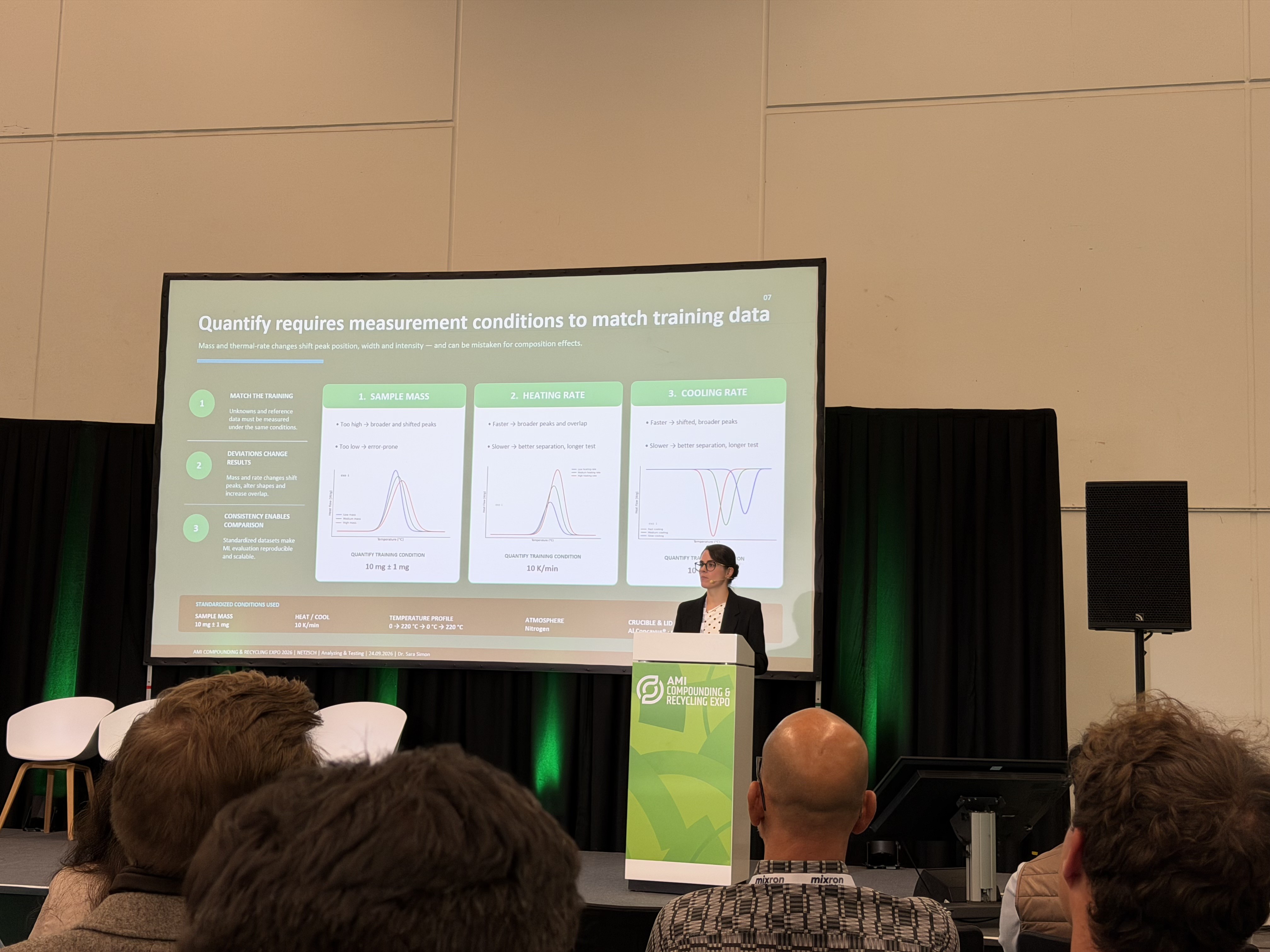 Presentation slide on machine learning and measurement conditions in material analysis at AMI 2026