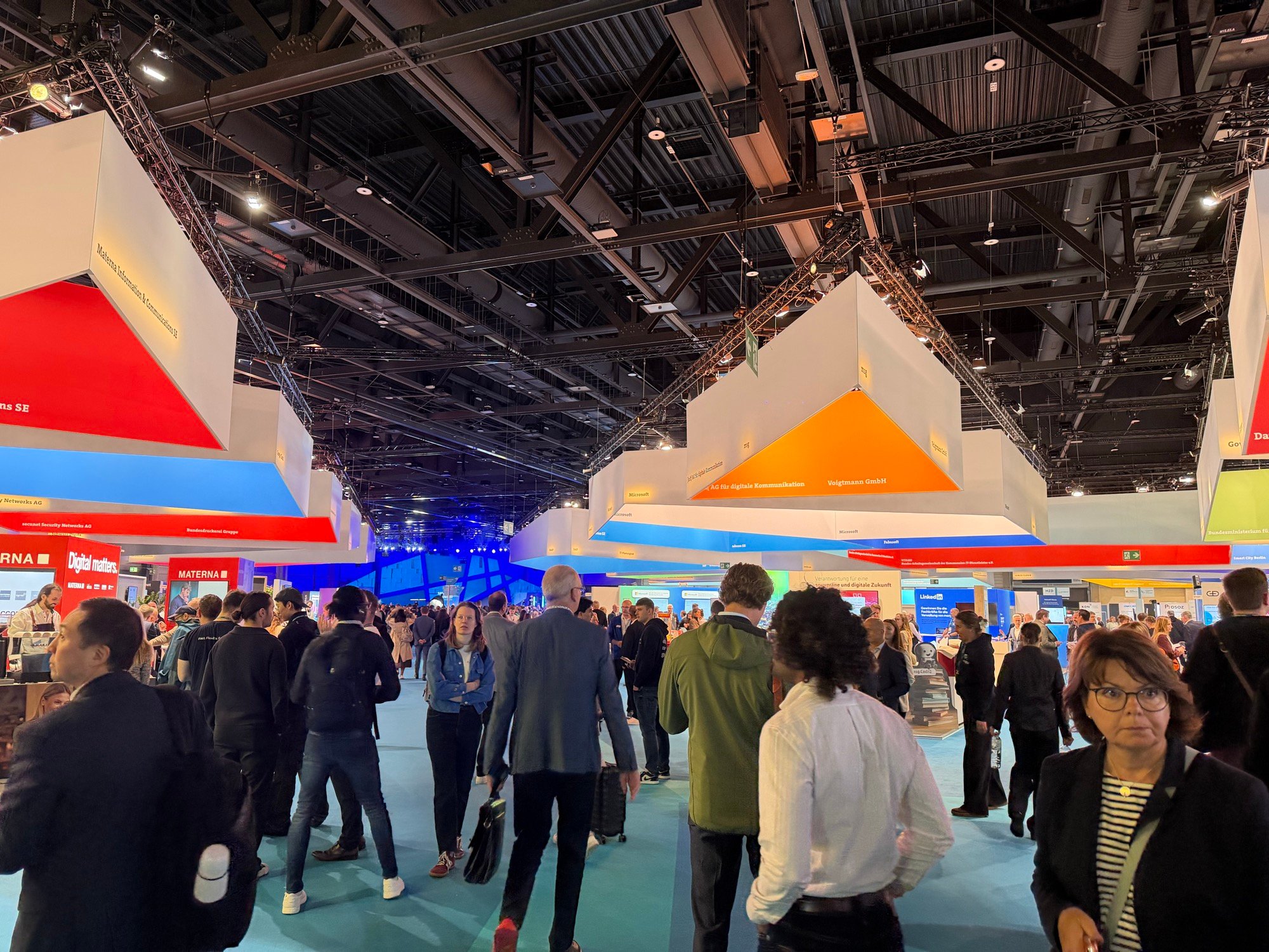 Visitors walking among exhibition stands in the SCCON 2026 exhibition hall
