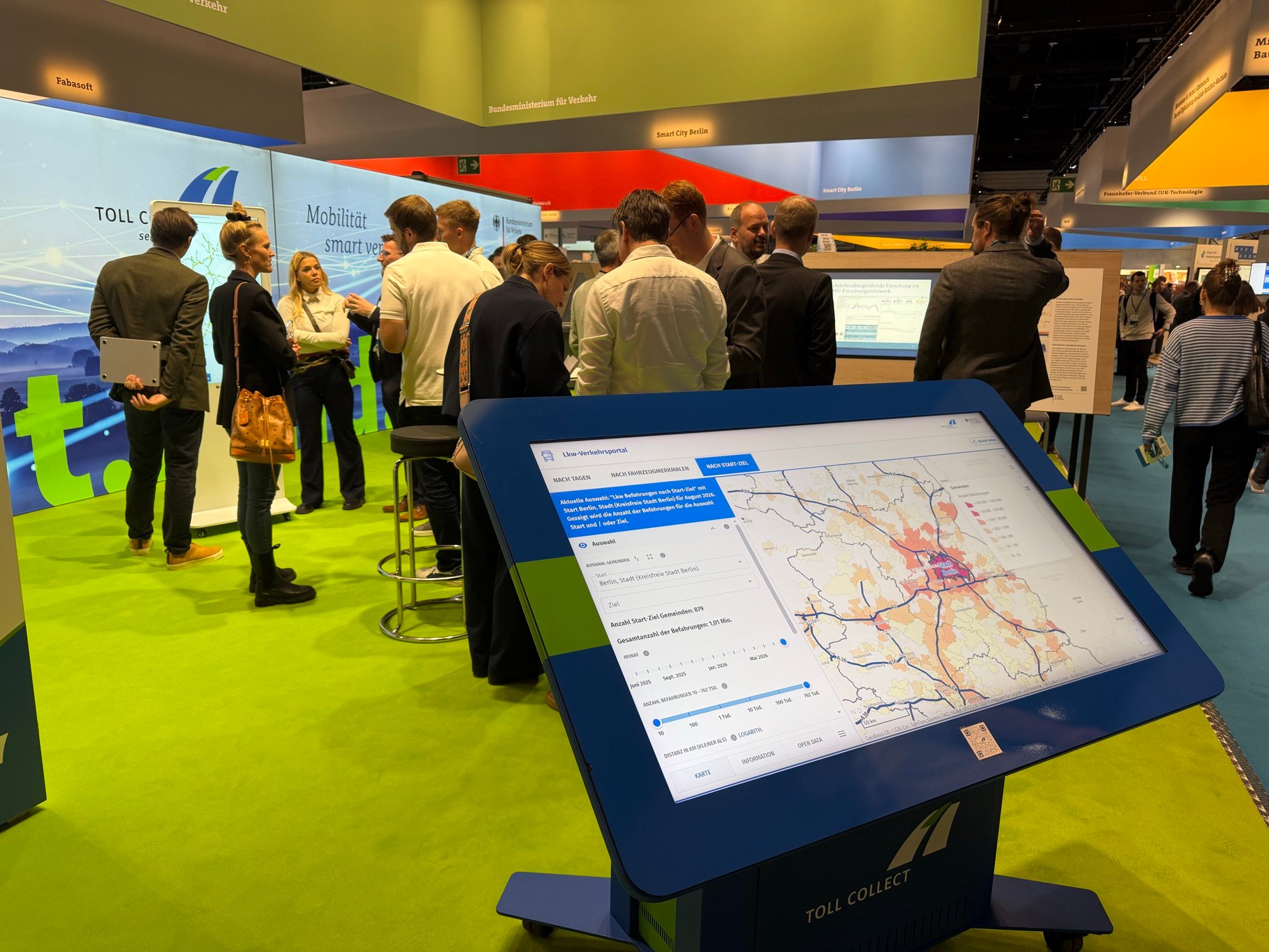 Interactive map display at the Toll Collect exhibition stand at SCCON 2026