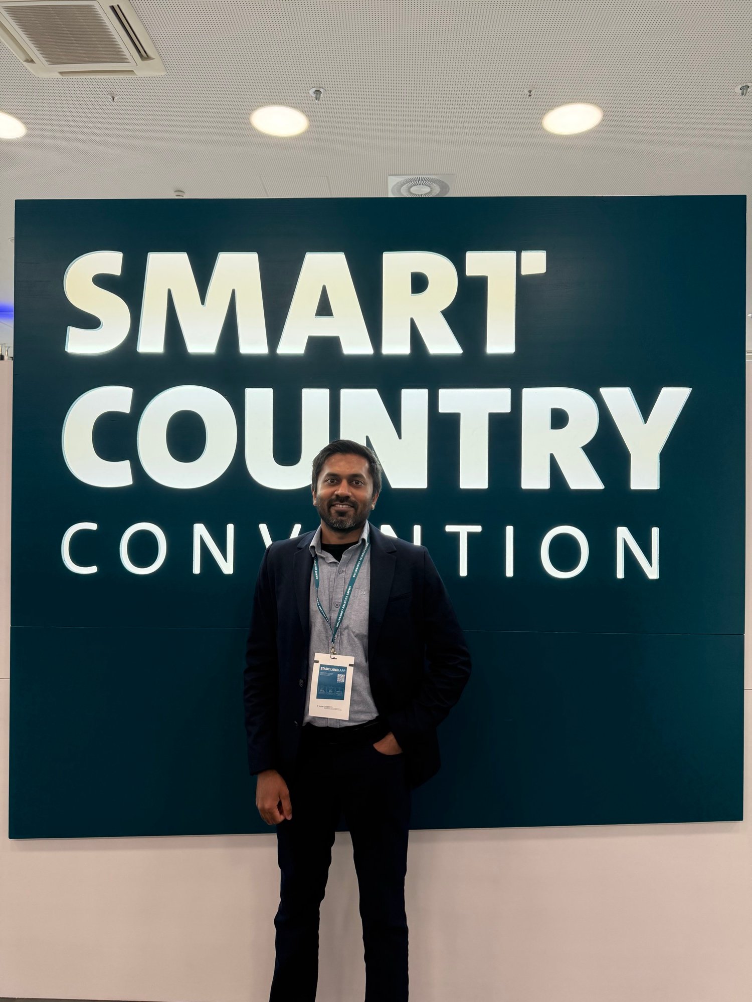 Portrait in front of the large Smart Country Convention sign