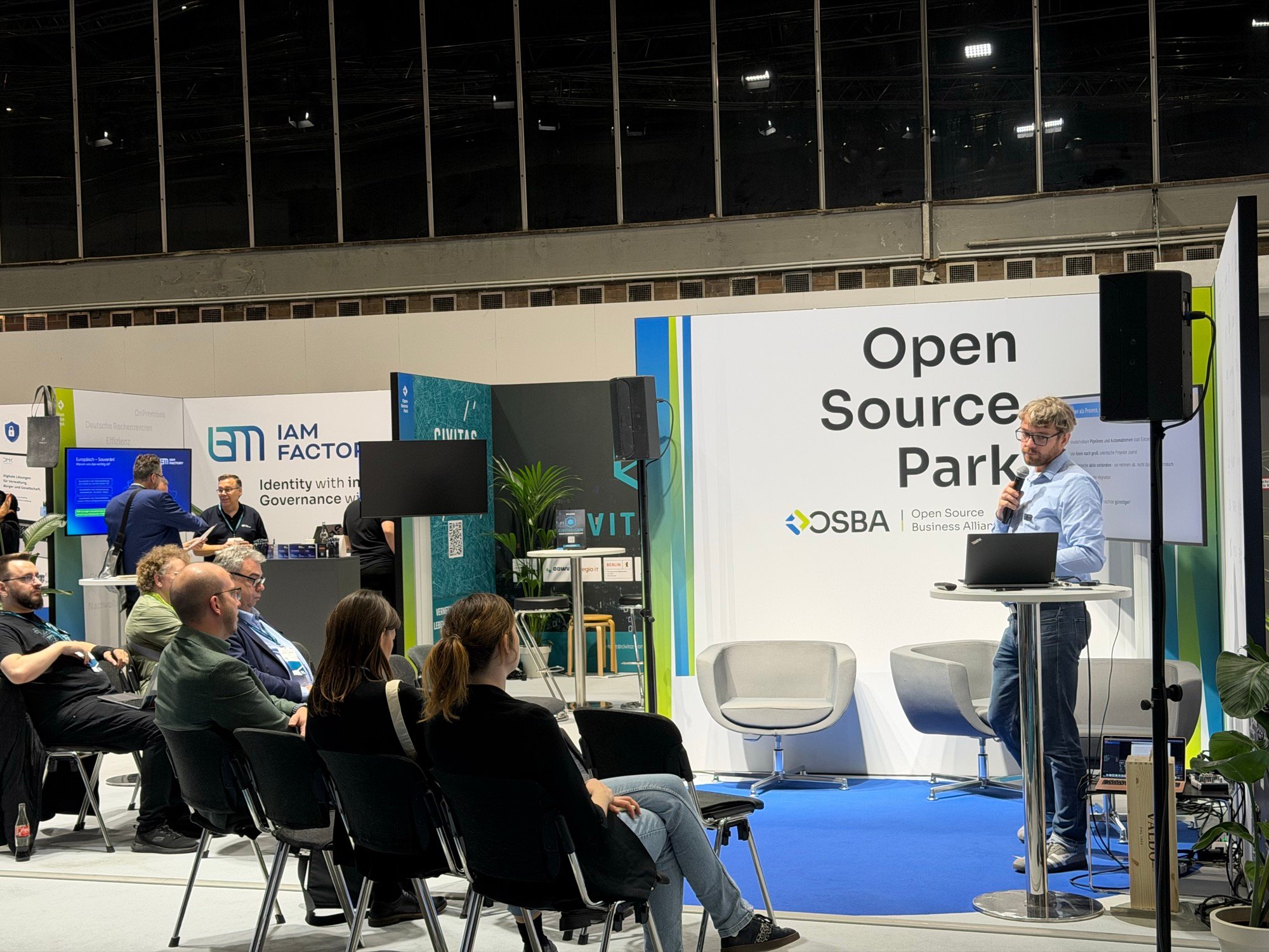 Presentation and seated visitors in the Open Source Park at SCCON 2026
