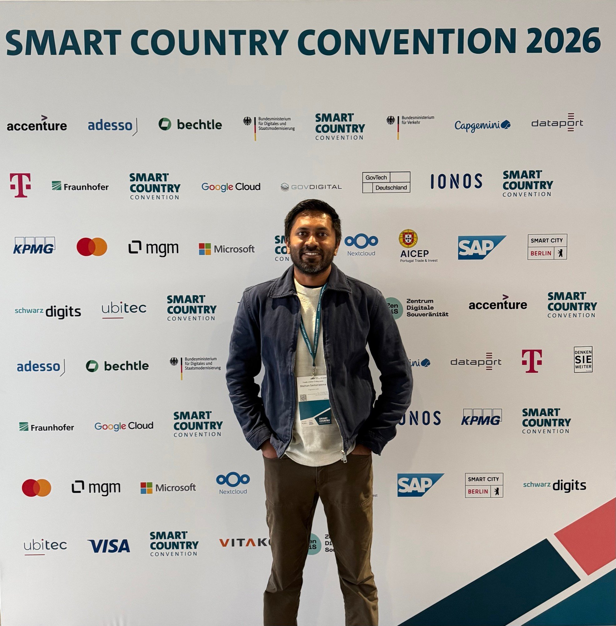Cognivox Labs founder Shehan Samarasena in front of the Smart Country Convention 2026 backdrop in Berlin